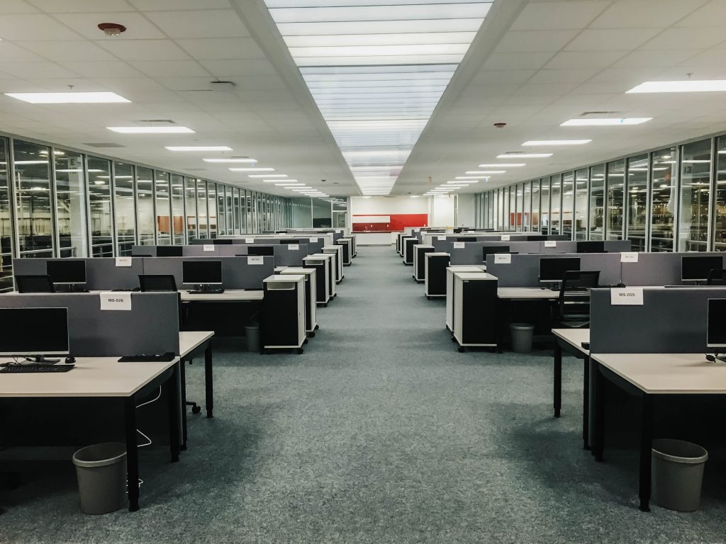 A photo of several desks in an office