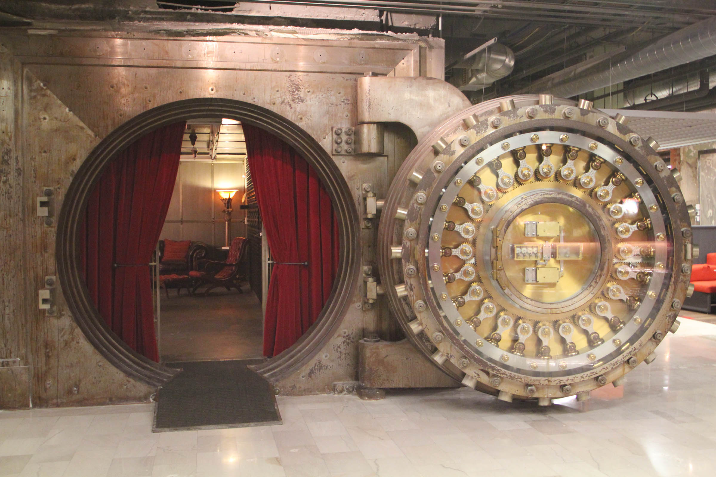 A picture looking into a large metal bank vault