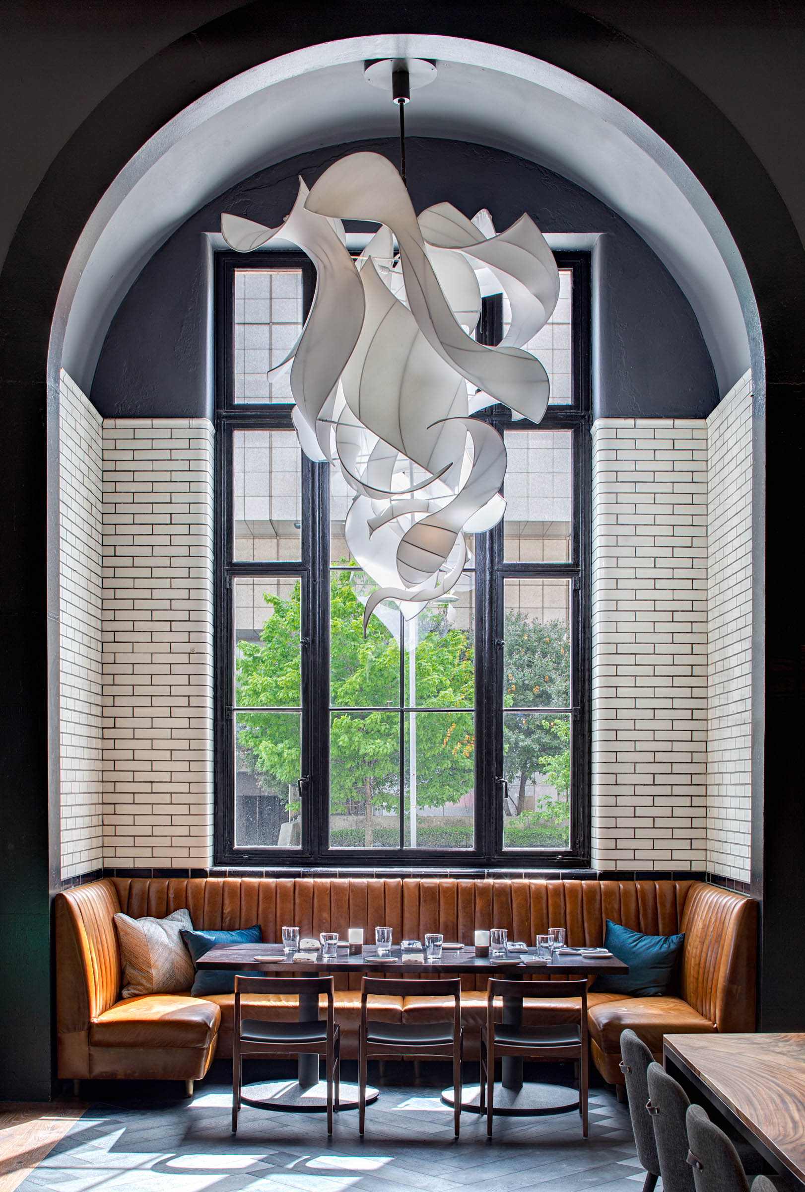 A photo of a bench beneath a window