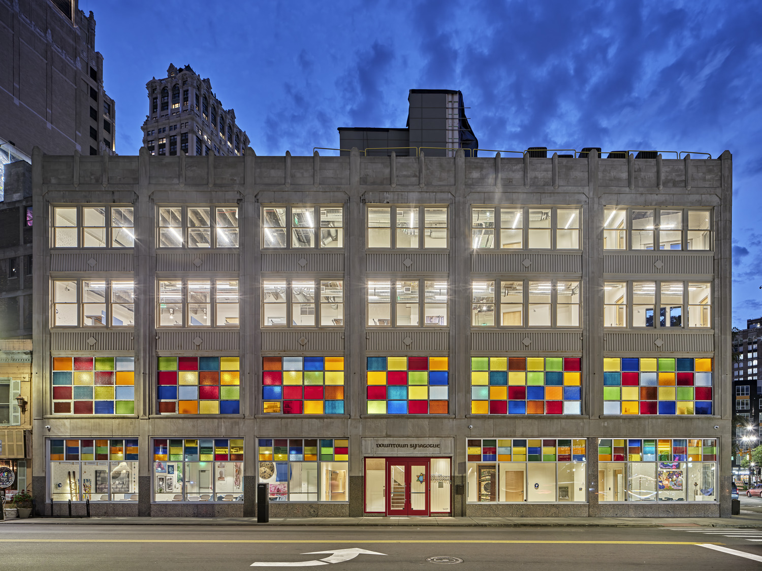 exterior of a synagogue with colored glass windows